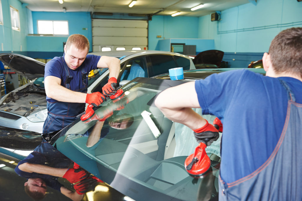 Automobile glazier adding glue on windscreen or windshield of a Clearview Automotive Glazing